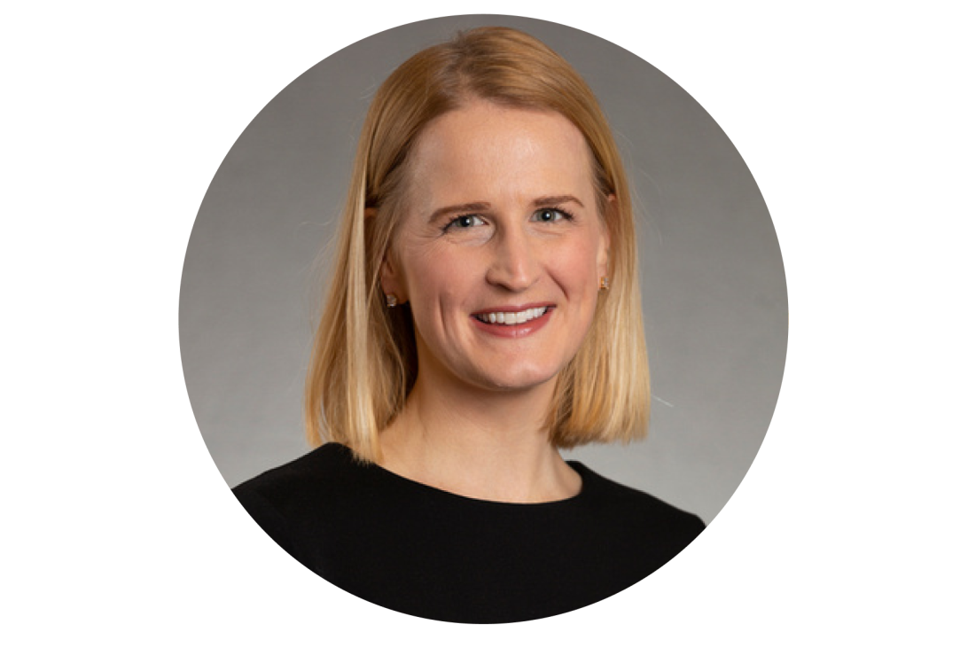 A portrait of Sarah Farabi smiling with a black dress sweater.