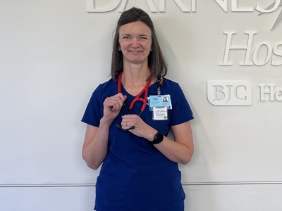 Student Jen Percich standing in front of wall.